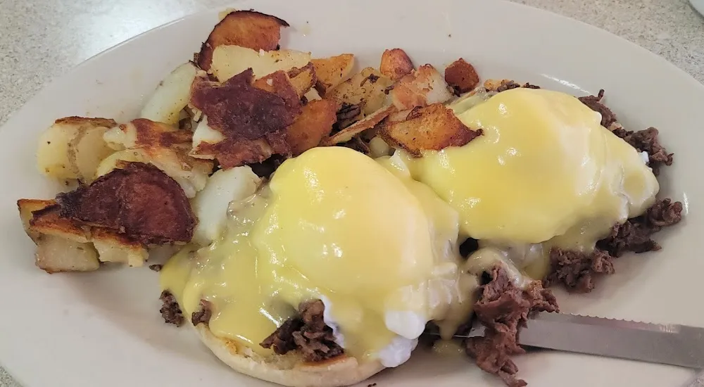 Eggs Benedict with Ribeye Steak and Home Fries